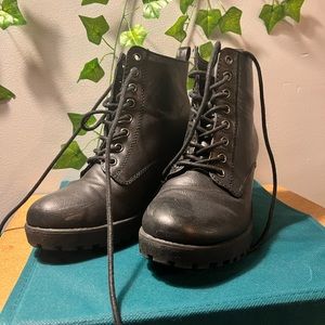 Black heeled combat boots